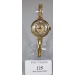 18ct gold ladies cushion shaped wristwatch with engine turned Arabic face and 18ct gold expanding