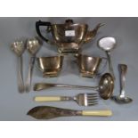 Assorted silver plated cutlery including: large ladle, salad servers etc. together with a three