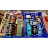 Two trays of assorted diecast model vehicles, some in original packaging, to include: buses and