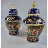 A pair of Vienna porcelain style baluster shaped lidded vases and covers, each having continuous