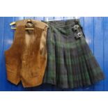 Vintage brown suede waistcoat with real leather, size XL labels and a green and blue tartan kilt