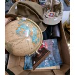 George F Cram table globe, various military and other hats, pair of leather gaiters and a Collin's