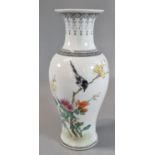 Chinese porcelain baluster vase depicting a bird on a yellow flowered branch, with other blooms