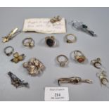 Jewellery case containing a small selection of assorted costume jewellery: rings, brooch, pins