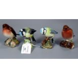 Four Beswick china wild birds to include: blue tit and robins. (4) (B.P. 21% + VAT) Chip to one