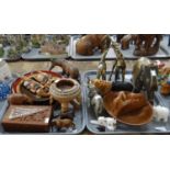 Two trays of mostly animal figures to include: two Art pottery giraffes, various carved wooden