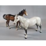 Two Beswick horses a Bay with white blaze and feet (22cm high approx) and a dapple grey, (21cm