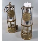 Two similar Protector Lamp & Lighting Co. type 6 brass Miner's safety lamps in un-used condition. (