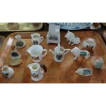 Tray of Crested souvenir ware items to include: Gemma Pottery mug with animal handle, oval 'Rich