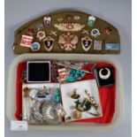 Collection of assorted Russian badges, various on a Forage cap, jade jewellery, silver rings and