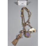 9ct gold charm bracelet with assorted charms including: tassel, bloodstone fob, mother of pearl
