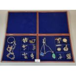 Two modern wooden jewellery cases with assorted silver jewellery, to include: silver and amber