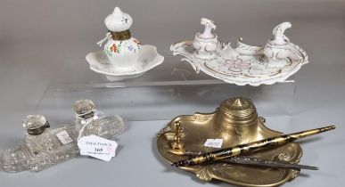 Collection of four porcelain, glass and brass desk inkwells, one particularly in Art Nouveau