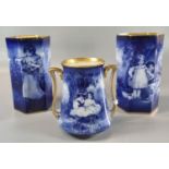 Set of three Royal Doulton Blue Children vases including a pair of hexagonal form, the tallest