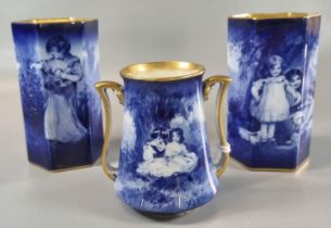 Set of three Royal Doulton Blue Children vases including a pair of hexagonal form, the tallest