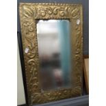 Early 20th century repoussé brass framed Art Nouveau style pier glass with rectangular plate. (B.