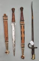 Late 19th century French sword bayonet, together with two tourist type jungle knives with leather