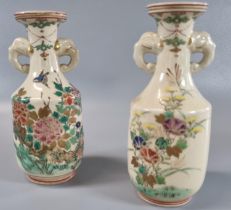 Pair of Japanese Satsuma gilded polychrome vases with elephant head handles, depicting flowers and