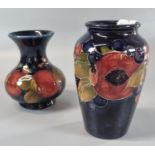 Two Moorcroft pottery tube lined Pomegranate vases of baluster and squat form, the tallest 11cm