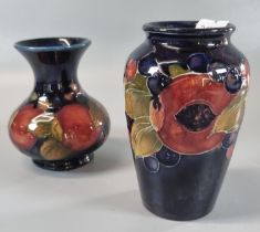 Two Moorcroft pottery tube lined Pomegranate vases of baluster and squat form, the tallest 11cm