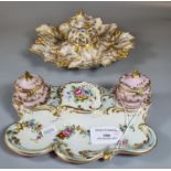 Two early 20th century continental porcelain floral and foliate inkwells. (2) (B.P. 21% + VAT)
