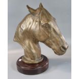 Good quality heavy bronze horse head with naturalistic features on a circular wooden mahogany