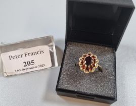 9ct gold and ruby flowerhead cluster ring. 4.2g approx. Size O1/2. (B.P. 21% + VAT)