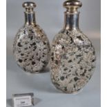 Pair of Japanese silver 950 dimple glass decanters with silver floral and foliate overlay in