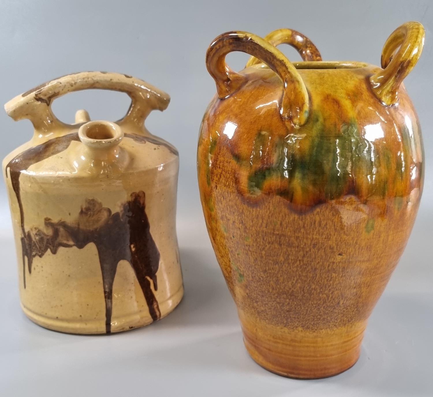 Ewenny pottery slip glazed baluster three handled vase together with a pottery glazed waisted design
