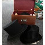 Leather travelling case containing three late 19th/early 20th Century hats to include: a Christys'