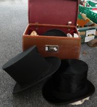 Leather travelling case containing three late 19th/early 20th Century hats to include: a Christys'