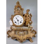 Early 20th century, probably French, gilt metal and alabaster two train figural mantle clock, with