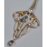 9ct gold Art Nouveau seed pearl and blue stone pendant on chain. (B.P. 21% + VAT)