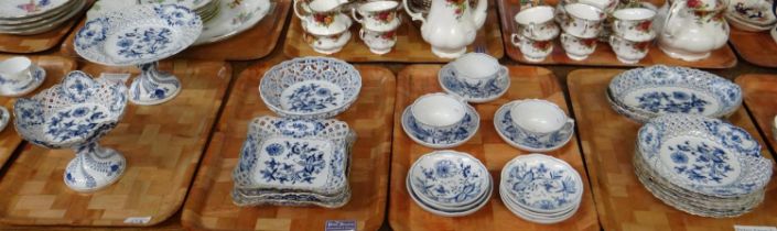 Four trays of blue and white Meissen porcelain 'Blue Onion' design items to include: teacups and
