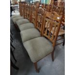 Set of six Art Nouveau design oak dining chairs with stuff over seats on tapering legs and