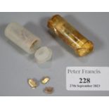 Two plastic tubs comprising dental gold. (B.P. 21% + VAT)