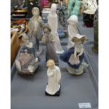 Tray of seven figurines to include: Spanish porcelain Lladro and Nao, Royal Doulton 'Darling'