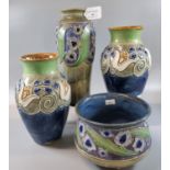 Collection of Royal Doulton stoneware items, raised with tube lined decoration of stylised flowers
