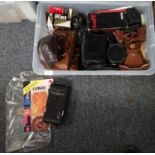 Box of cameras and accessories to include: various camera cases, Kodak folding camera, Polaroid land