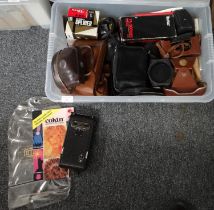 Box of cameras and accessories to include: various camera cases, Kodak folding camera, Polaroid land