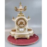 19th Century French alabaster and gilt metal two train clock on associate fabric oval base. (B.P.