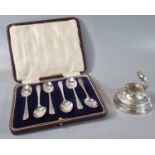 Silver single desk inkwell with Birmingham hallmarks, together with a cased set of six silver