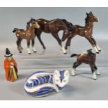 Four Beswick ceramic foals. Together with a Royal Crown Derby paperweight in the form of a recumbent