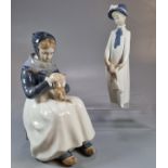 Royal Copenhagen Danish porcelain figurine of an Amager woman knitting, shape no. 1317. Together