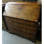 Late 18th/early 19th Century mahogany fall front bureau, having four long drawers with brass swan