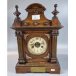 Early 20th century walnut two train architectural presentation mantle clock with a plaque dated