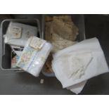 Two boxes of textiles to include: various table linen; embroidered tablecloths, crochet doilies