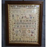 Mid 20th Century well worked tapestry sampler in 19th Century style, bearing initials C.J.B, dated