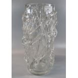 Clear art glass vase of cylinder form with raised abstract decoration to the outside, probably