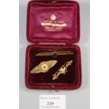 9ct gold and purple stone bar brooch (2.5g approx), together with a 15ct gold floral ruby and